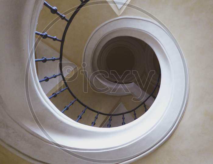 Up The Stairs In A Circle. Ceiling Cream