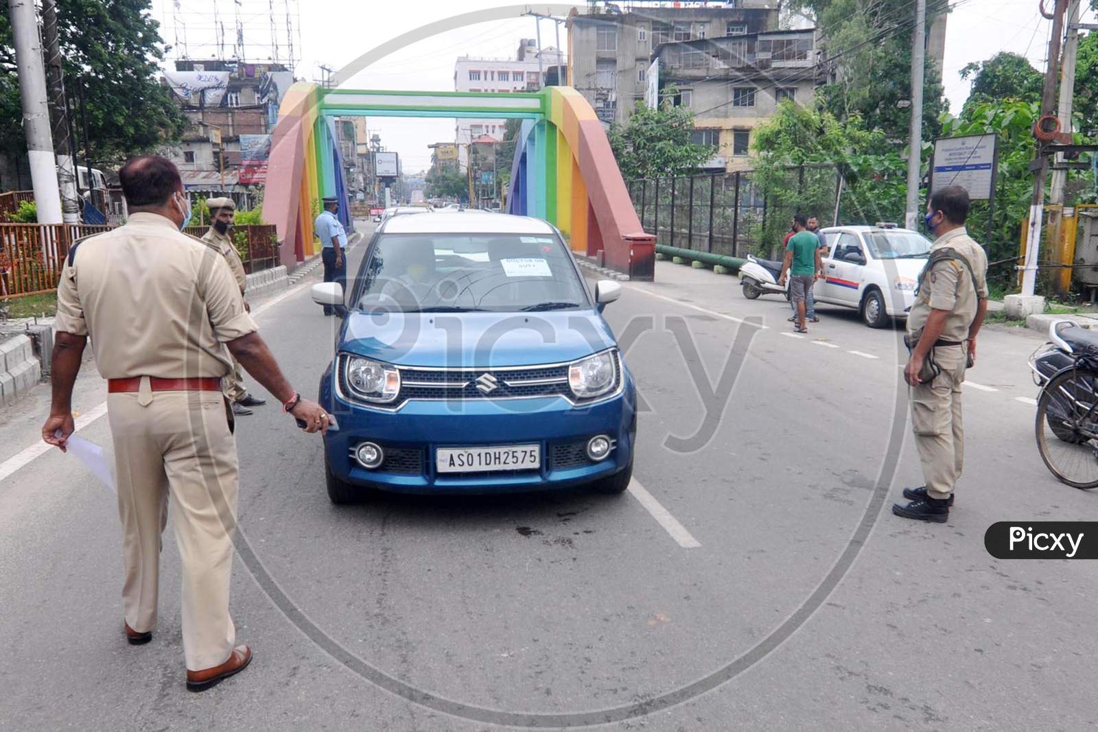 Security Personnel Stop A Commuter During A Total Lockdown Imposed By The Assam Government To Contain The Spread Of Coronavirus, In Guwahati on June 29,2020