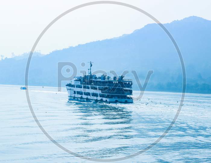 Running Ship Behind Seagull Are Flying With Natural Charming Scenery . Morning View On River With Natural View At Chittagong,Bangladesh..