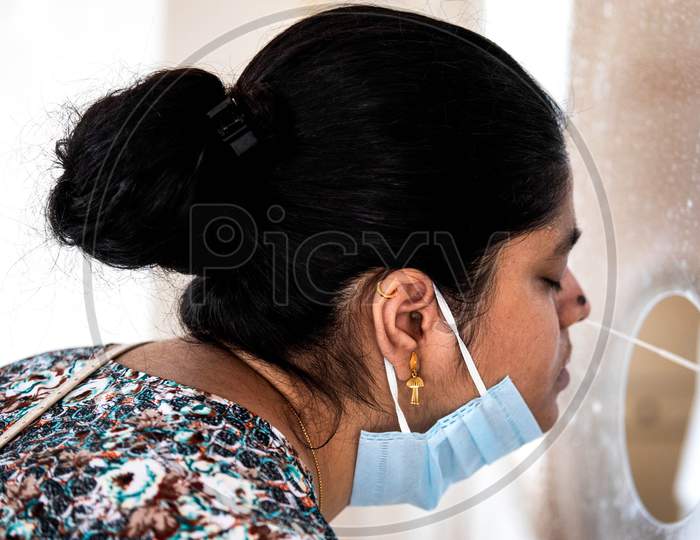 A Health Worker Collects Swab Sample From A Woman For Covid-19 Antigen Test, At Mayur Vihar On June 29, 2020 In New Delhi, India.