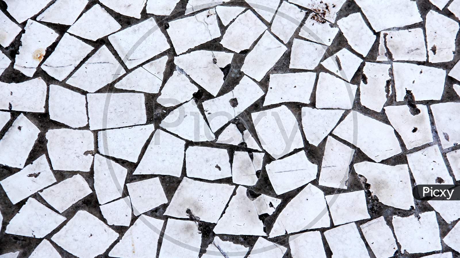 Top View Of Worn Out Vintage White Abstract Tile
