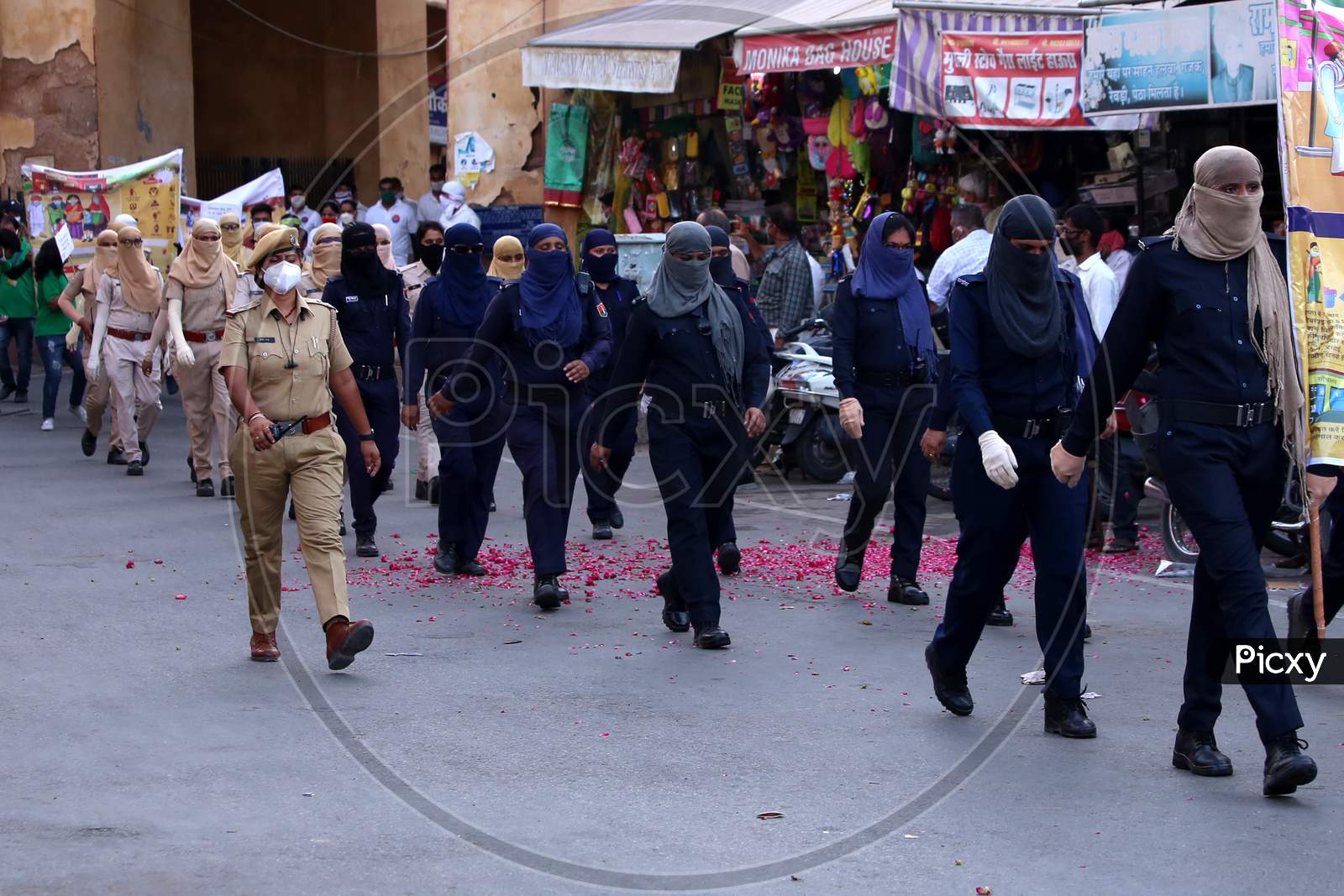Female Police officers participate in a flag march organised to spread awareness on Covid-19 during a lockdown in Ajmer, Rajasthan