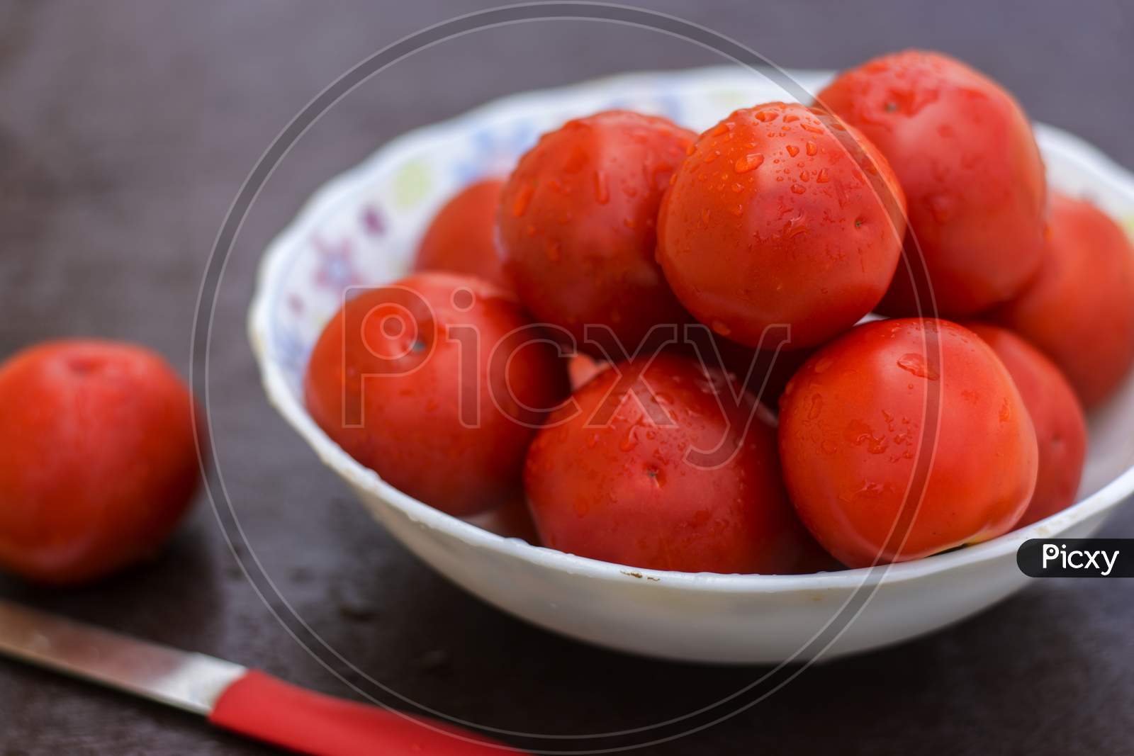 Red Organic Tomatoes In A Bowl