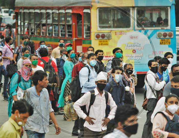 People wait to board a public bus, after the government eased a nationwide lockdown that was imposed as a preventive measure against the COVID-19 coronavirus, in Mumbai, India, on June 26, 2020.