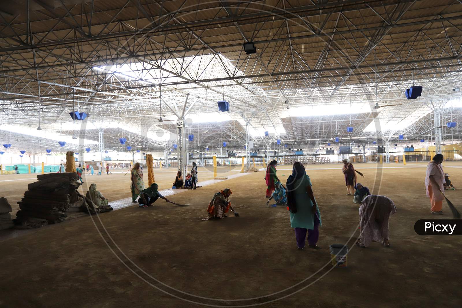 Volunteers Sweeping The Floor Inside The Covid-19 Care Centre At Radha Soami Satsang Beas As They Prepare A Facility That Can Accommodate More Than Ten Thousand Covid-19 Patients, One Of The Biggest In India, In Chattarpur, On June 26, 2020 In New Delhi, India.