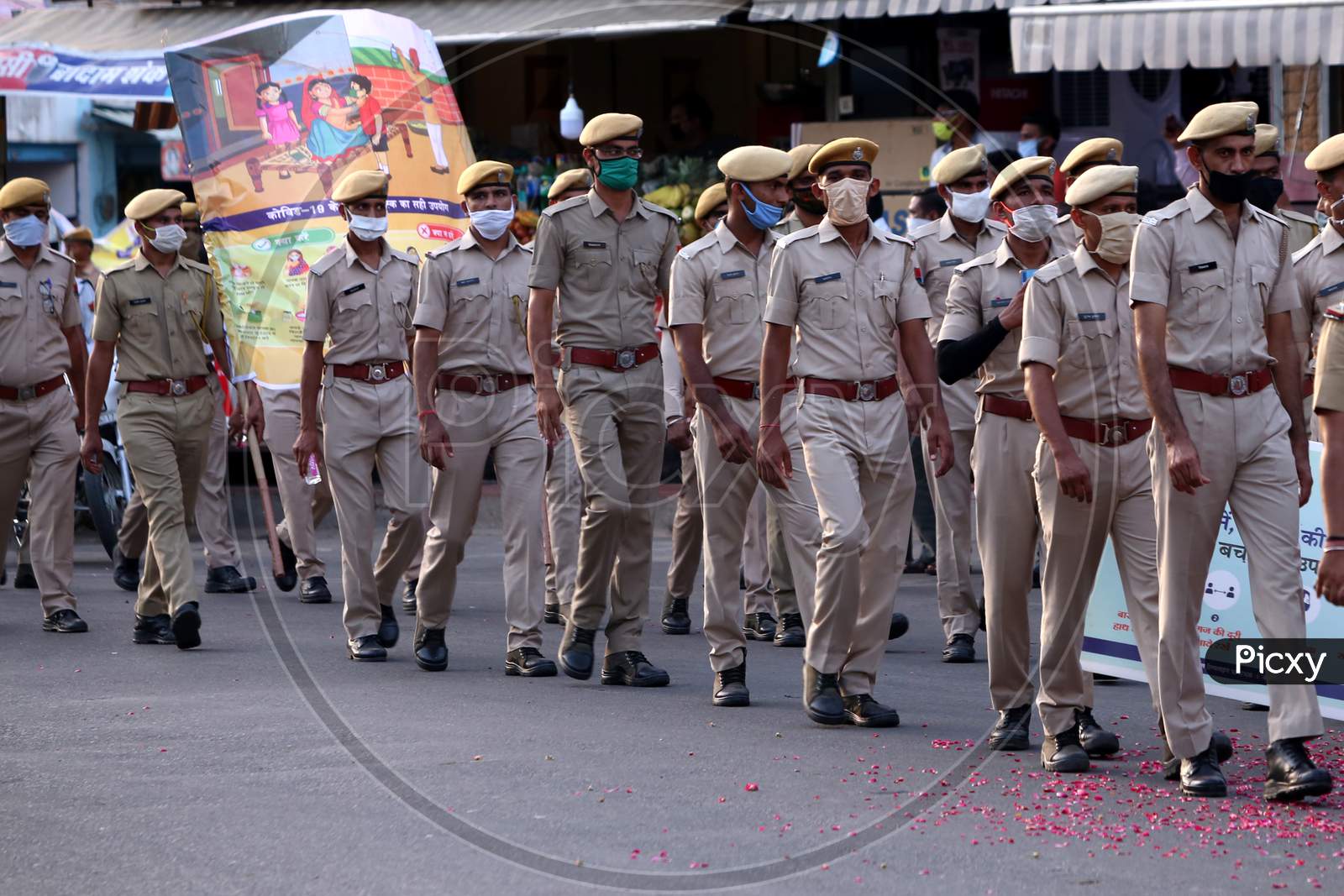 Police personnel participate in a flag march organized to spread awareness on Covid-19 in Ajmer, Rajasthan on July 02, 2020