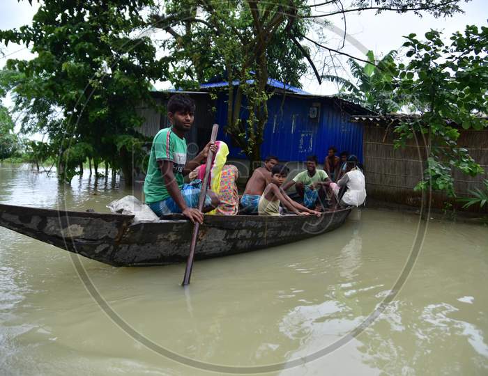 Flood Affected Villagers Are Transported On A Boat  Towards A Safer Place In Morigaon District Of Assam  on june 29,2020.