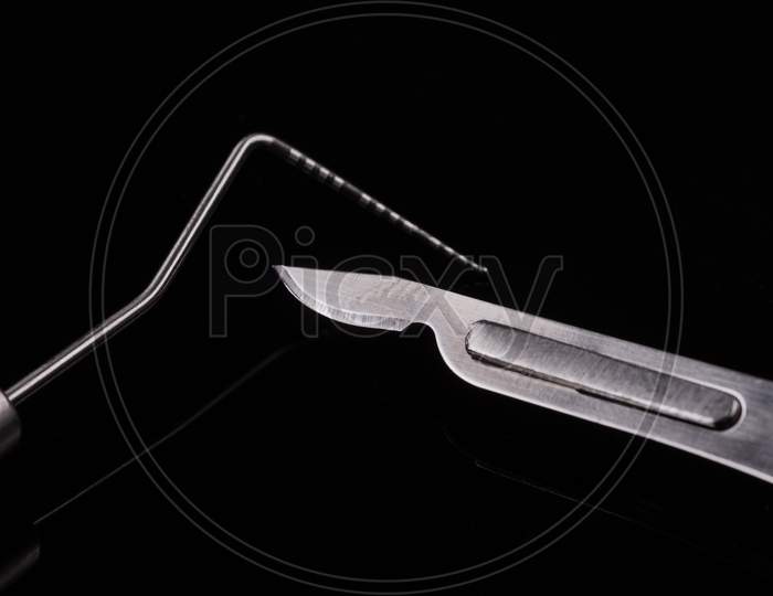 Closeup Of Professional Dental Tools. Periodontal Probe And Scalpel.