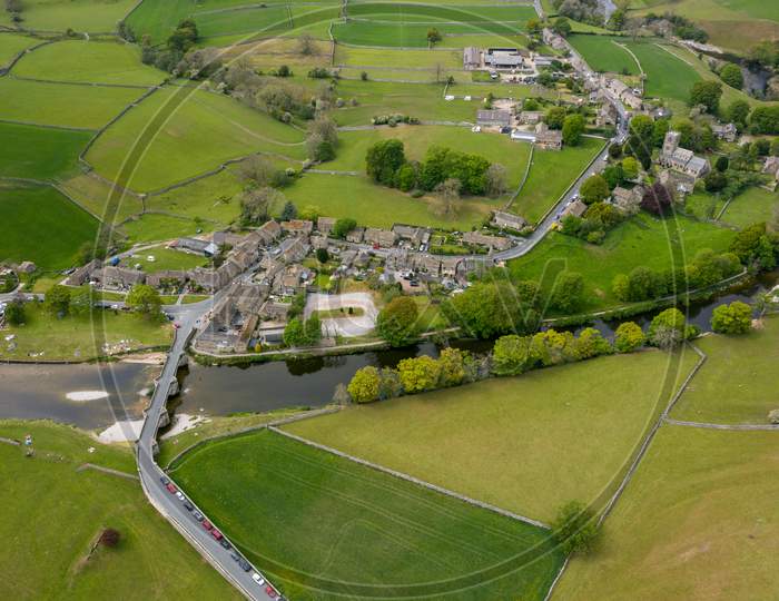 Aerial View Of Burnsall, And Its Well Known Bridge Across The River Wharfe Yorkshire Dales National Park, North Yorkshire, England.