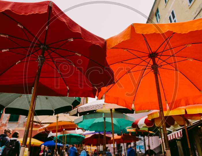 Colourful Umbrellas Street In Italy
