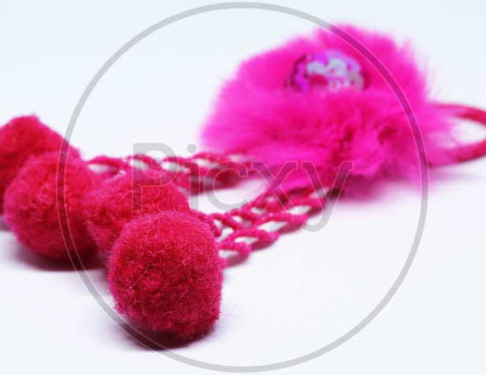 Pink Color Fedar rubber bands on a white background