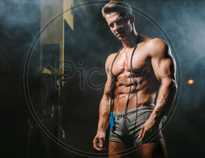 Handsome Caucasian Sexy Fitness Model In Gym Close Up Abs