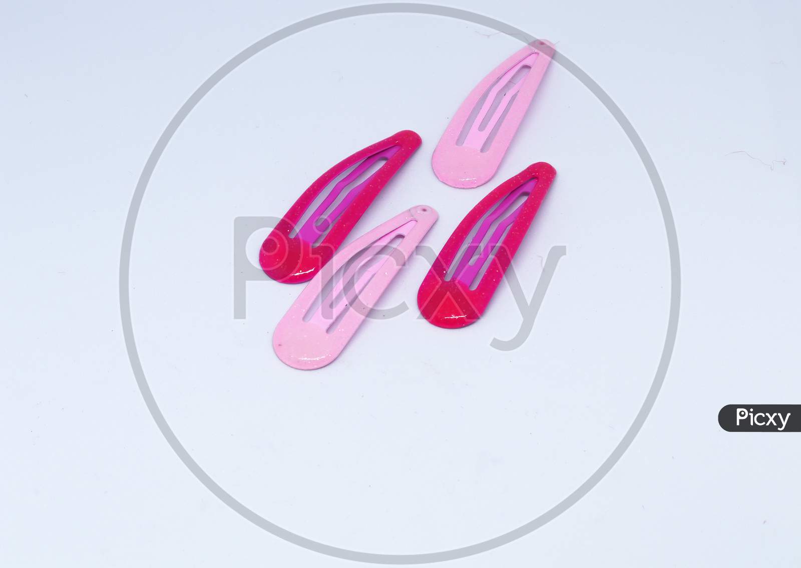 Pink and red hair claw clips isolated on white background with clipping path