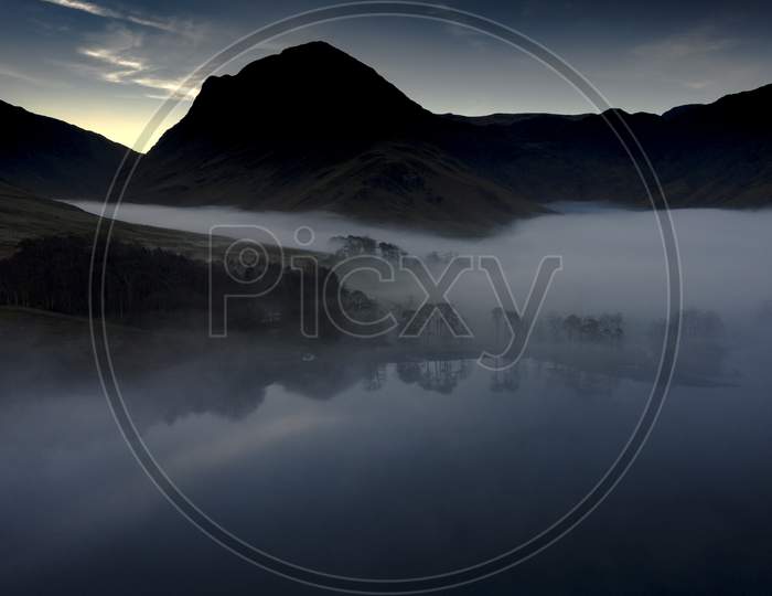 Aeriel Shot Of Buttermere, The Lake In The English Lake District In North West England. The Adjacent Village Of Buttermere Takes Its Name From The Lake.