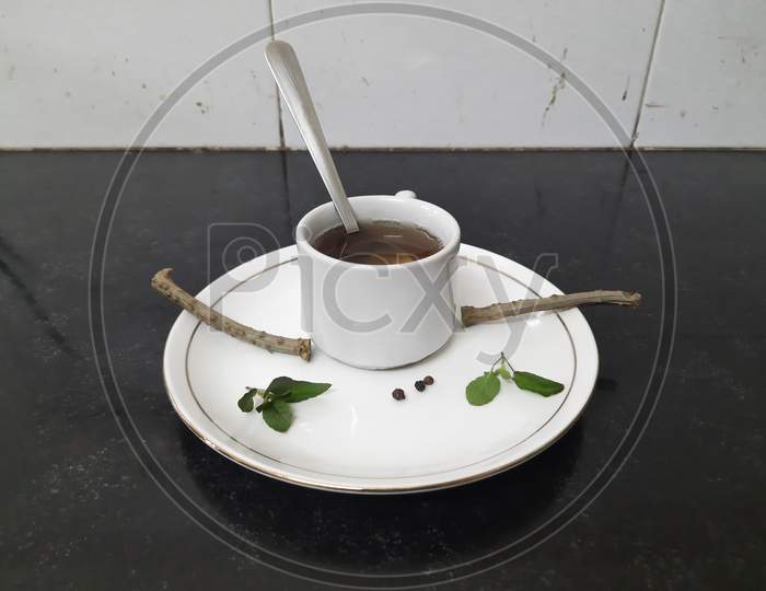 Tinospora cordifolia  / giloy tea with basil.