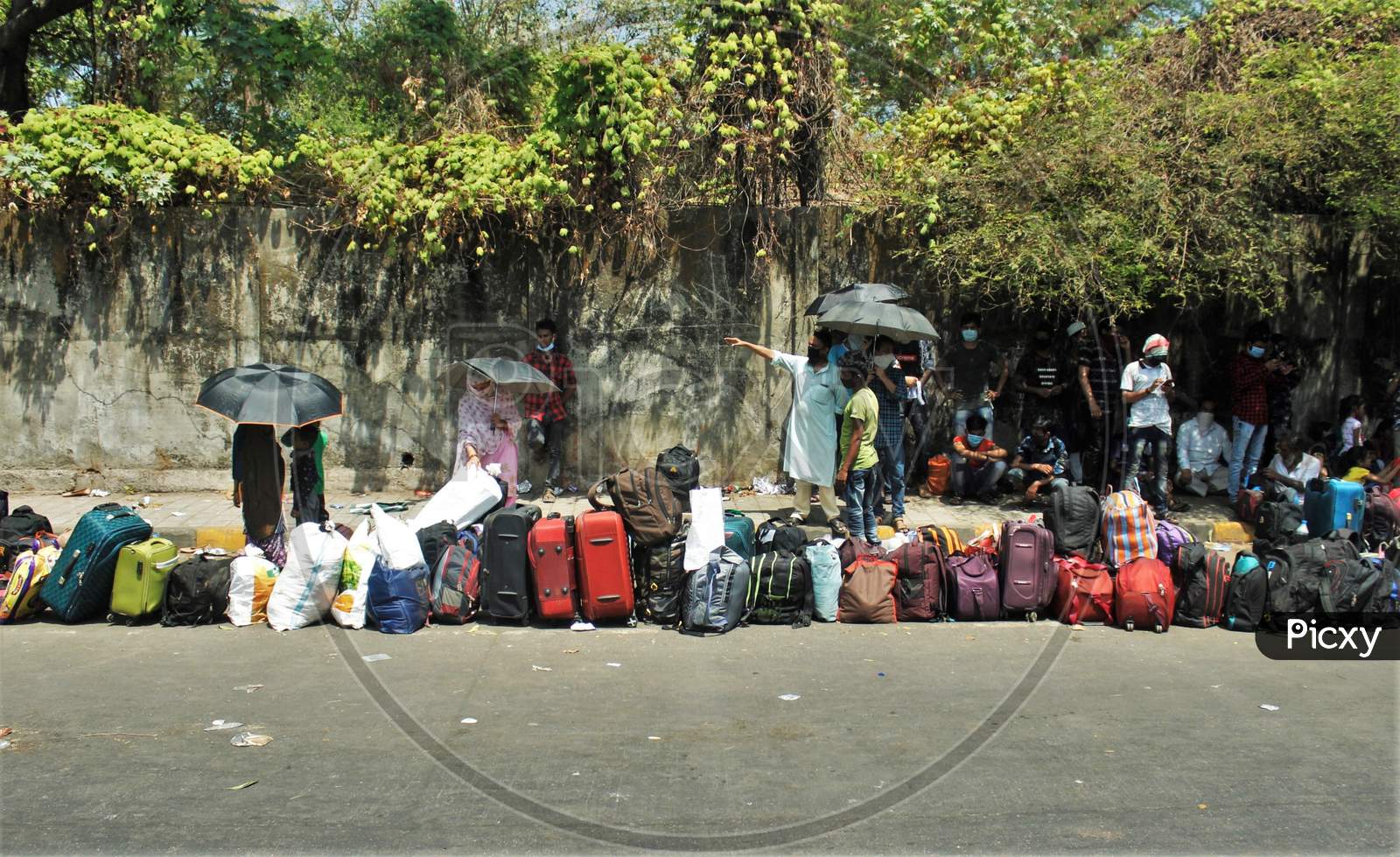 Bags are seen lined up as people wait outside Chhatrapati Shivaji Maharaj Terminus(CSMT) to board a train that will take them to their home state during an extended lockdown to slow the spreading of the coronavirus disease (COVID-19), in Mumbai, India on May 27, 2020.