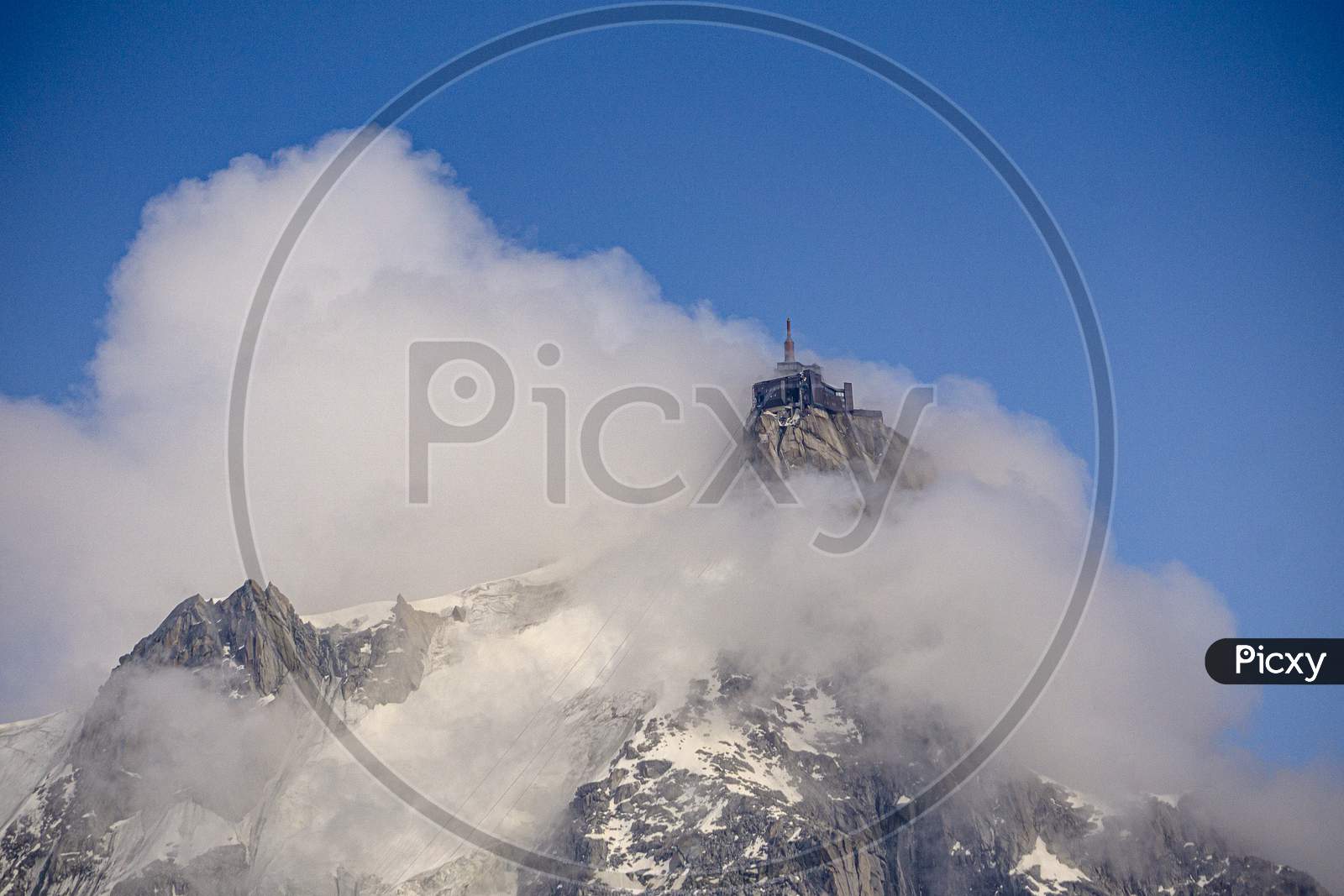The Aiguille Du Midi Shrouded In Low Cloud