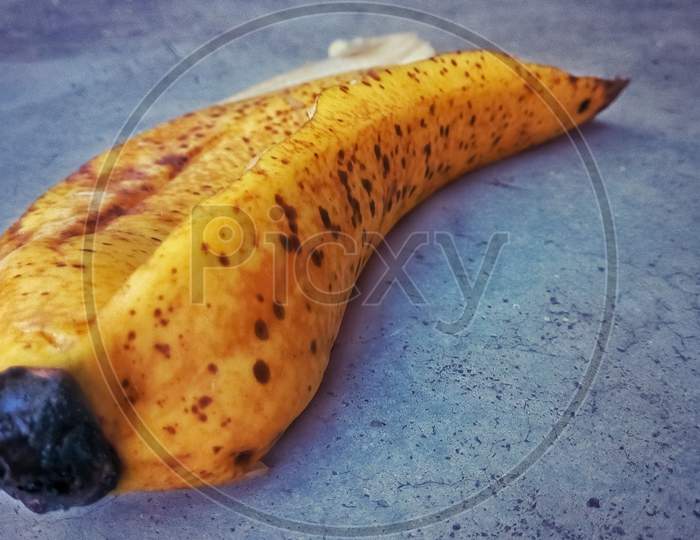 Banana peel picture yellow on ground