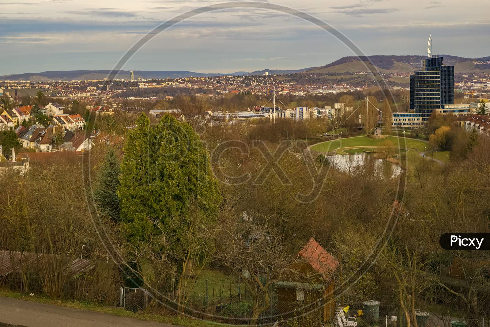 Stuttgart,Germany - March 12,2019:Killesberghoehe This Is The View From Sankt-Helens-Steg To The Northside Of The City With A Small Park,Old And New Buildings And Green Hills.