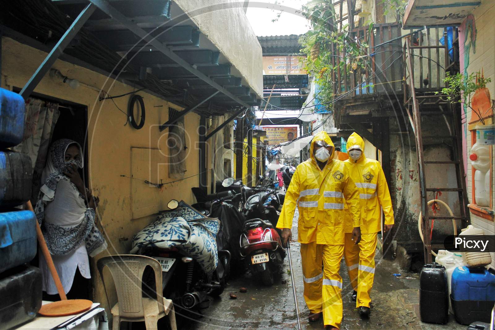 Mumbai Police does patrolling inside a slum area off the coast of the Arabian sea, in Mumbai, to evacuate the residents, as cyclone Nisarga makes its landfall, on the outskirts of the city, June, 3, 2020.