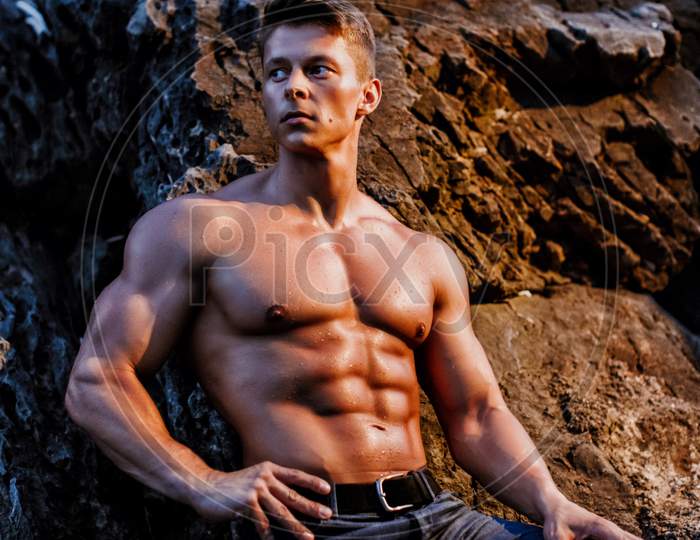 Handsome Muscular Man Shirtless Wearing Jeans Outdoors