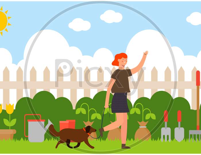 Woman Walking In The Garden With Her Dog