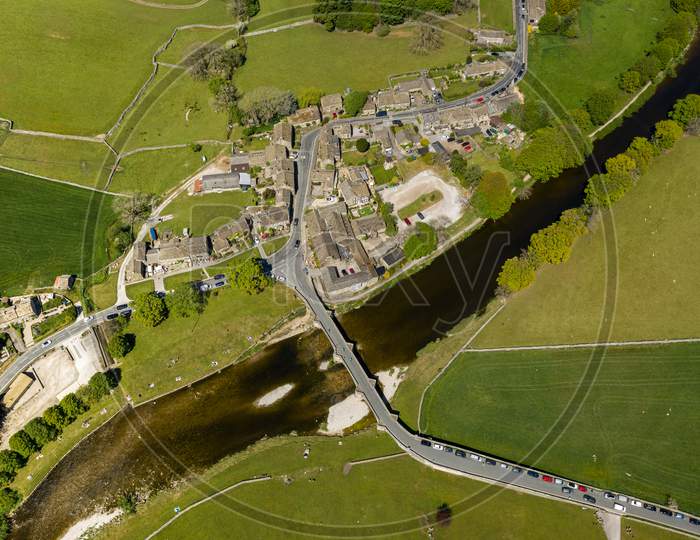 Aerial View Of Burnsall, And Its Well Known Bridge Across The River Wharfe Yorkshire Dales National Park, North Yorkshire, England.