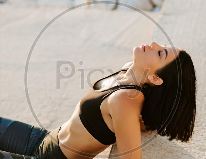 Sporty Woman Relaxing Outdoors