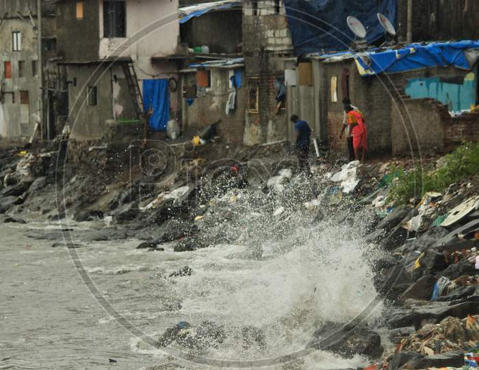 Sea waves strike at a slum area near the Arabian sea as cyclone Nisarga makes its landfall on the outskirts of the city, in Mumbai, India, June 3, 2020.