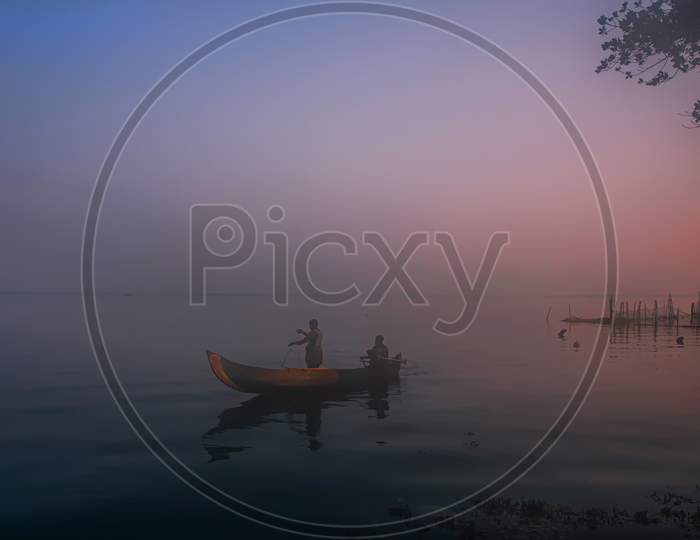 The silence of the dawn on the Vembanad lake, Kerala, India