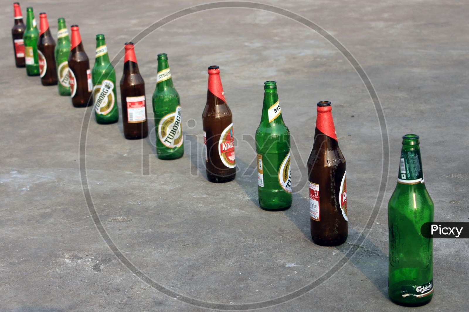 Alcohol or Beer Bottles on a Beach Shore