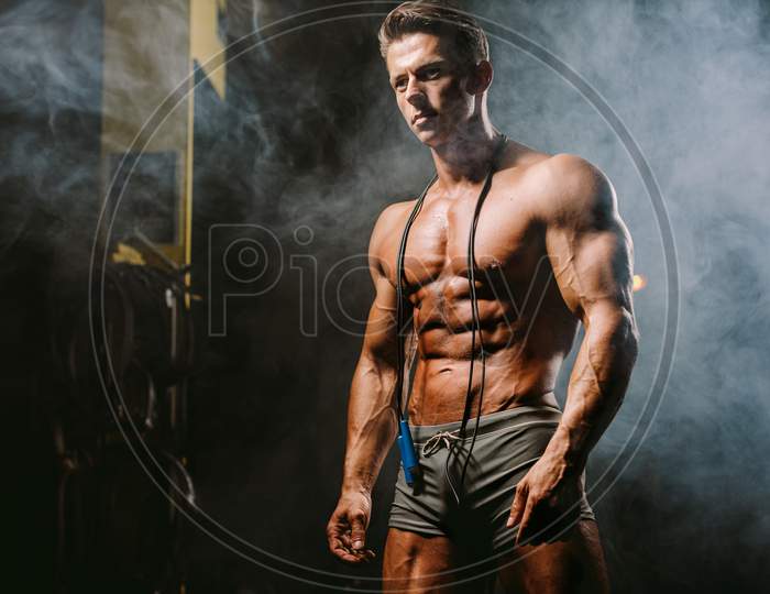 Handsome Caucasian Sexy Fitness Model In Gym Close Up Abs