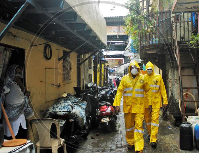 Mumbai Police does patrolling inside a slum area off the coast of the Arabian sea, in Mumbai, to evacuate the residents, as cyclone Nisarga makes its landfall, on the outskirts of the city, June, 3, 2020.