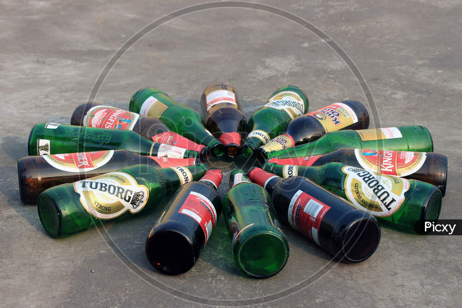 Alcohol or Beer Bottles on a Beach Shore