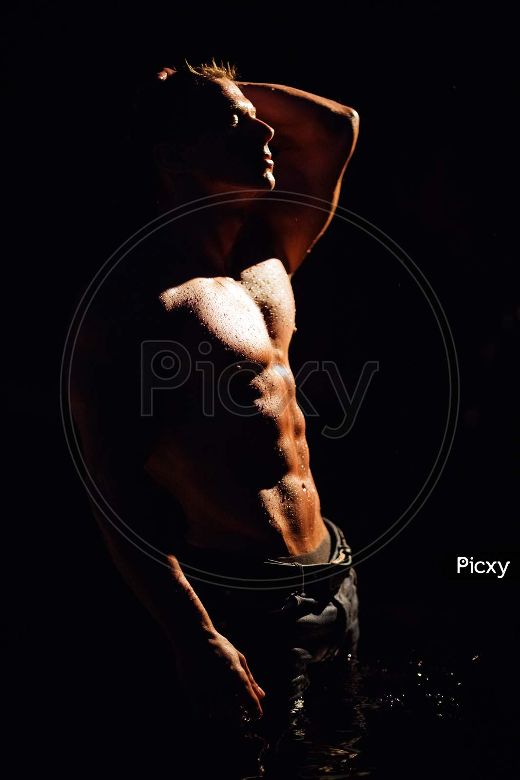 Silhouette Of Sexy Muscular Man Shirtless Wearing Jeans