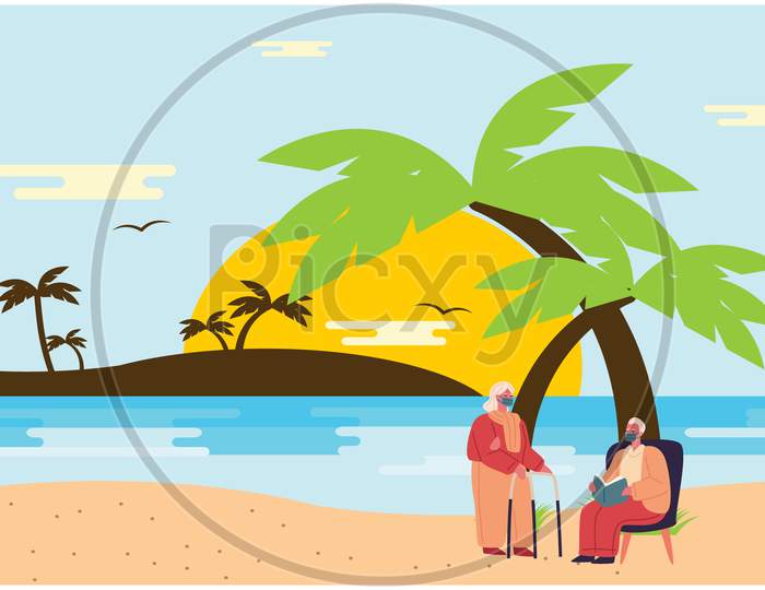 Old Couple Sitting On A Beach