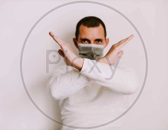 Man Showing Stop Sign To Virus And Diseases