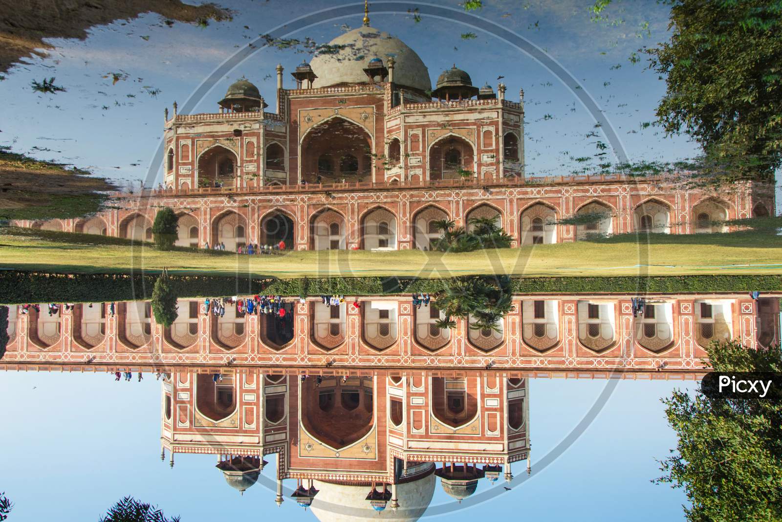 Reflection of Humayun’s Tomb on the waterlogged gardens.