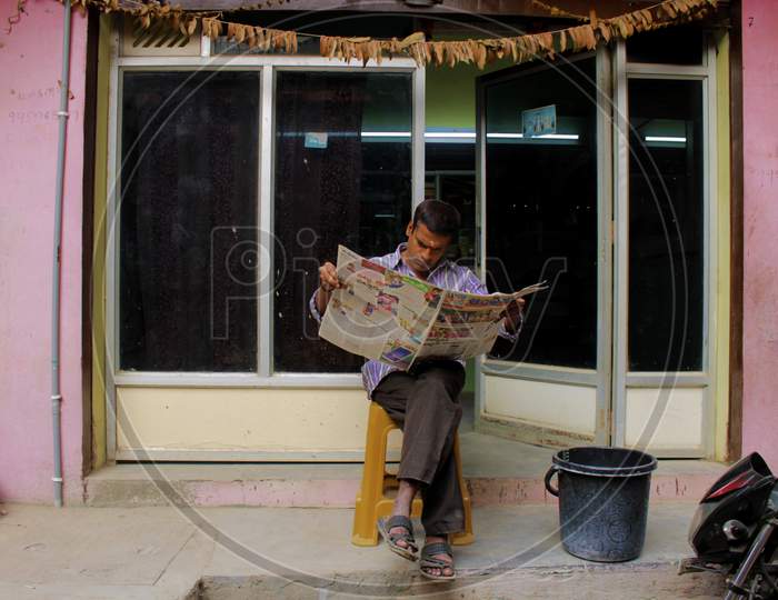 Man reading news paper
