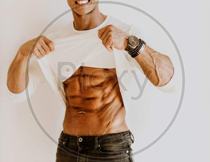 Brutal Muscular Man Wearing White Shirt Showing Abs Muscles