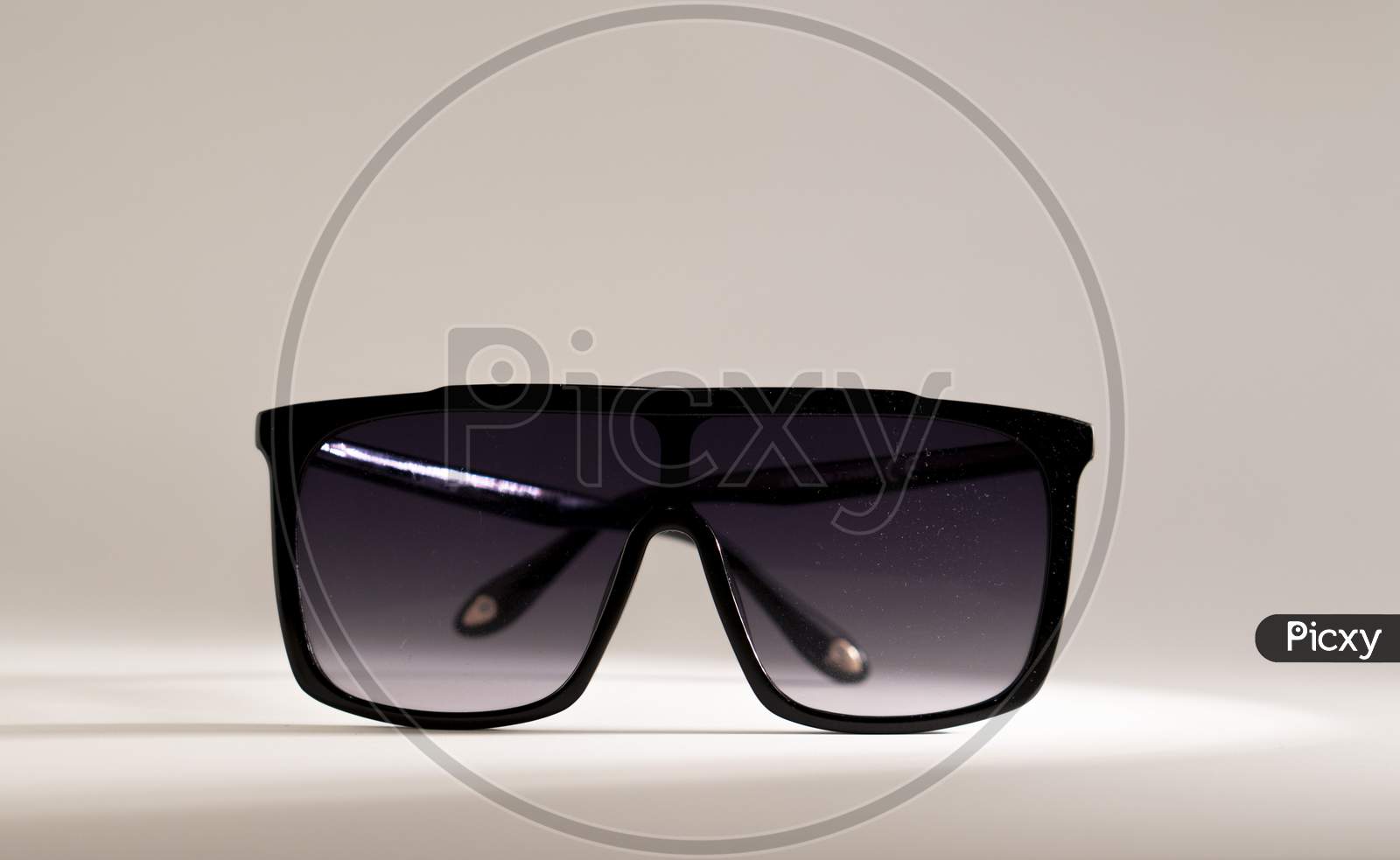 Oversized shaded sunglass on a white background