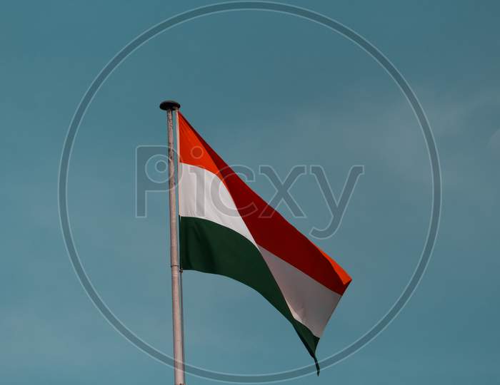 India Flag Waving In The Blue Sky