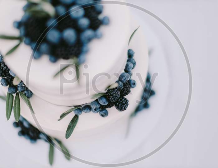 White Wedding Cake With Blueberry And Blackberry
