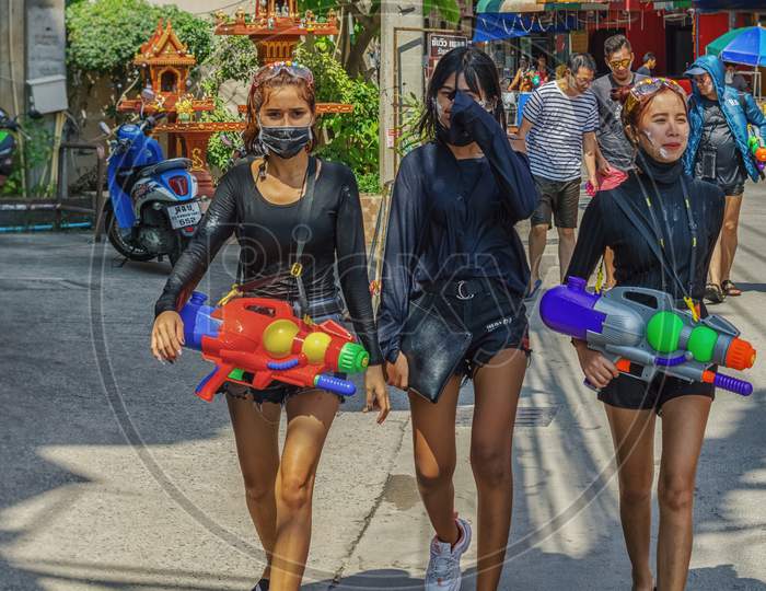 Pattaya,Thailand - April 18,2018: Soi Buakhaow A Group Of Young Thai Women Is Celebrating Songkran With Water Pistols. Songkran Is The New Years Eve Of The Country.