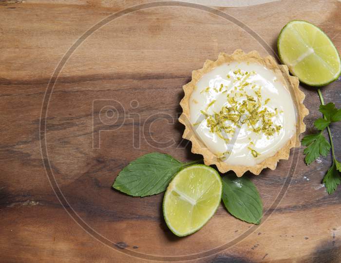 Top View Of Traditional French Lemon Tart On Wooden.