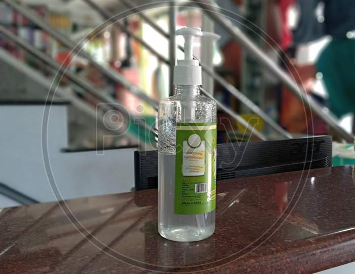 Hand sanitizer kept on top of shop counter for customers to sanitize their hands
