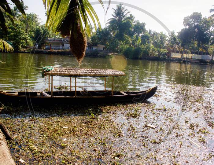 A Scenic View Of A Boat In Backwaters Situated In Allepey Town Located In Kerala State
