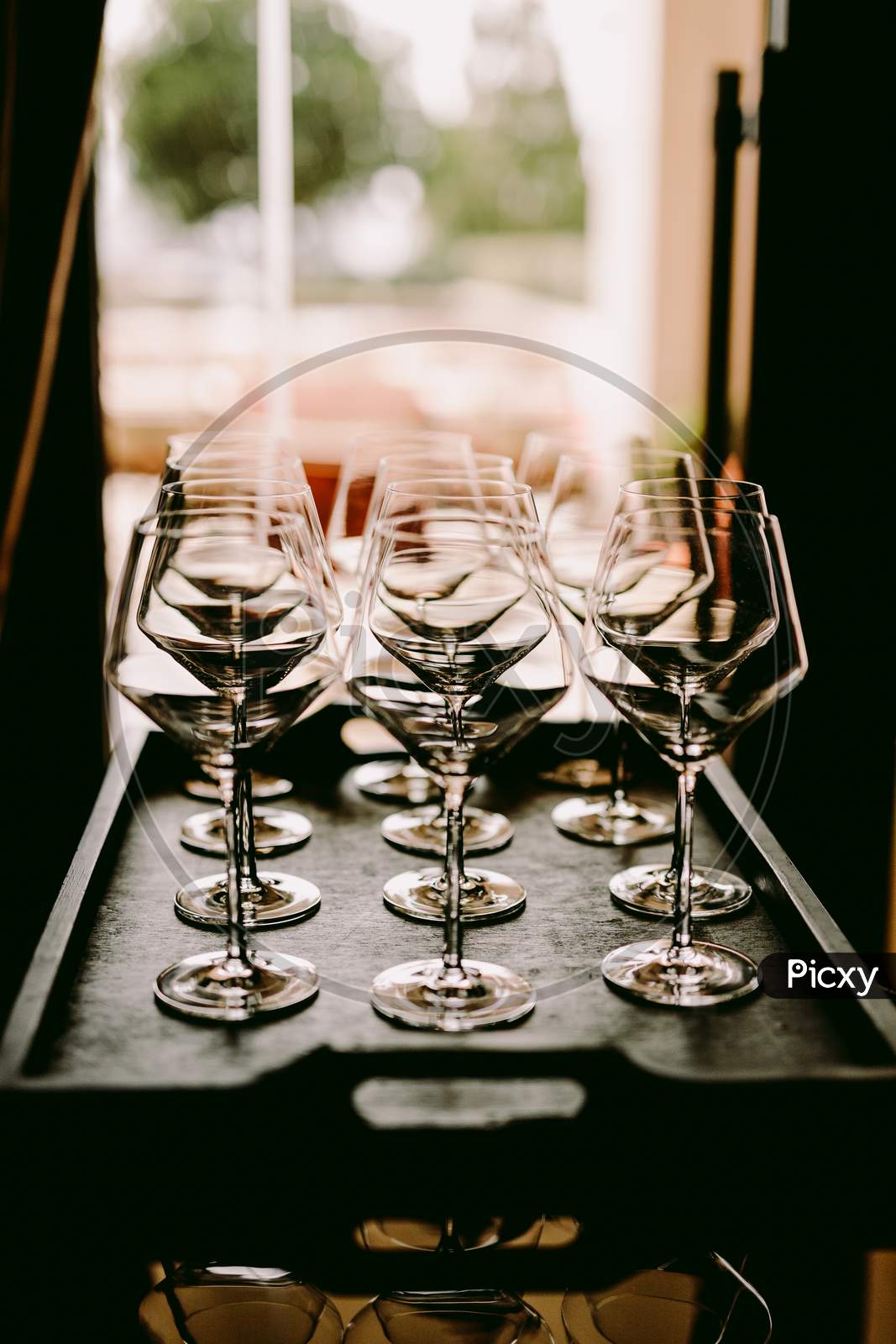 Empty Wine Glasses On Tray In Restaurant