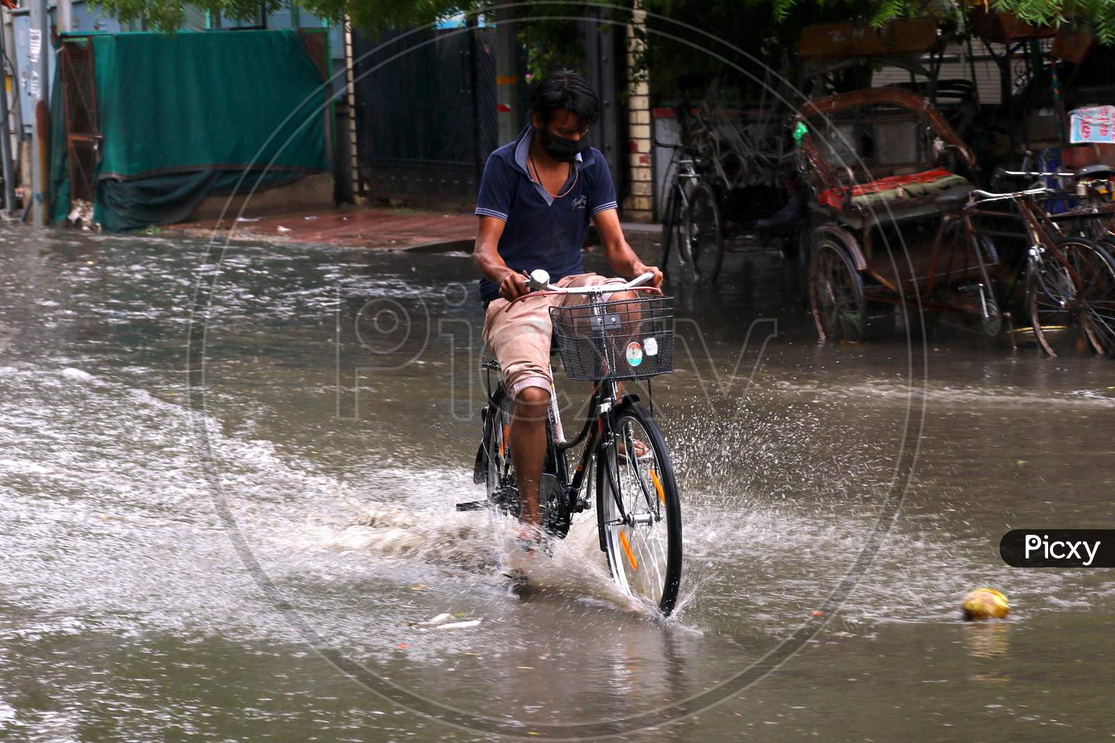 A Bicycle  Rider On A Waterlogged Road During Rain, In Ajmer, Rajasthan, India On 04 June 2020.