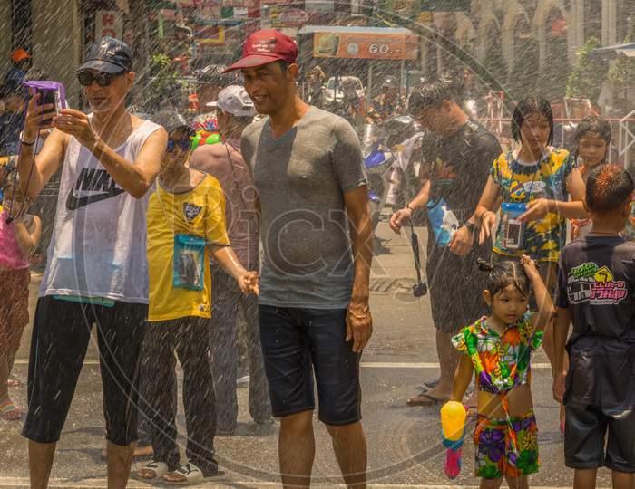 Pattaya,Thailand - April 19,2019:Beachroad Young And Old People Were Celebrating The Last Day Of Songkran With Water Games.
